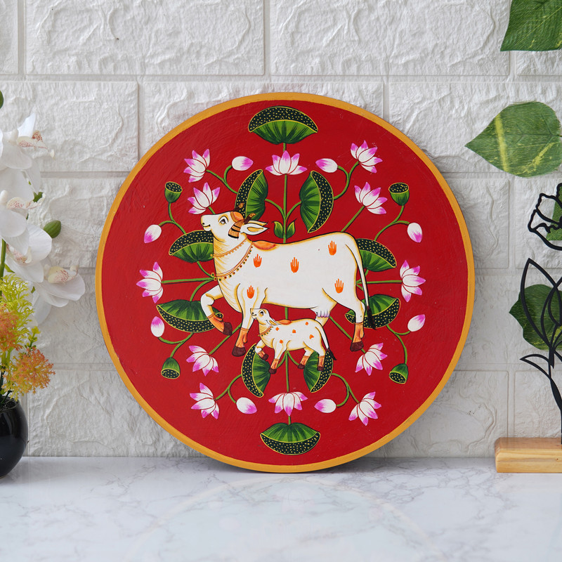 This beautiful pichwai painting features a mother cow and her calf, a timeless symbol of nurturing love.